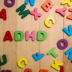 ADHD letters surrounded by different alphabet letters 