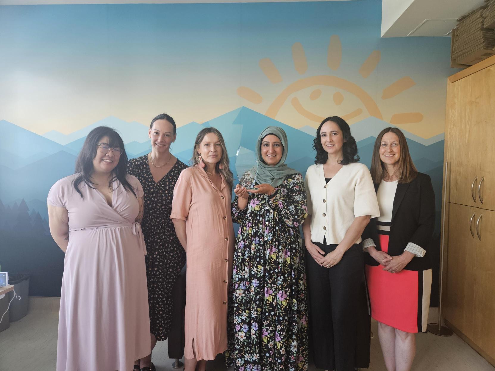 Pictured from left to right: Kathryn Jahn, Project Coordinator; Amy Franses, FamilySmart Family Peer Support Worker; Mirella Russell, FamilySmart Family Peer Support Worker; Sanaa Majid, Program Manager; Michelle Cianfrone, Director; Bryn Askwith, Project Manager.