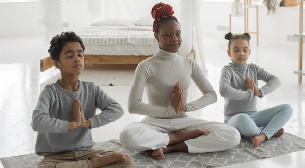 Mother and children practicing mindfulness together