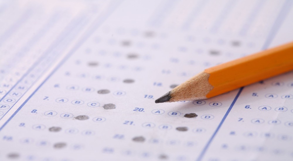A pencil filling out a test form