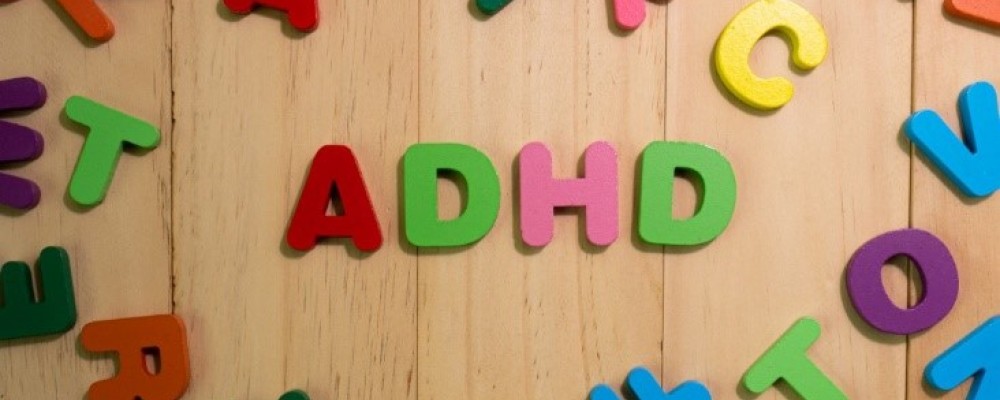 ADHD letters surrounded by different alphabet letters 