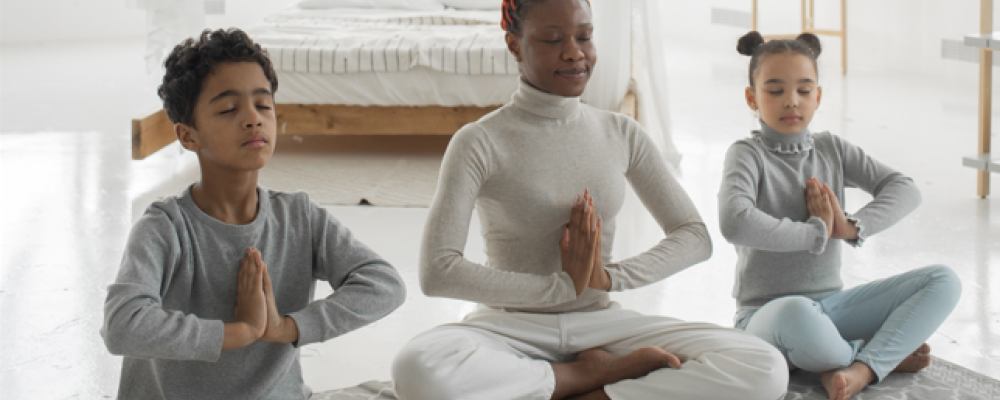 Mother and children practicing mindfulness together