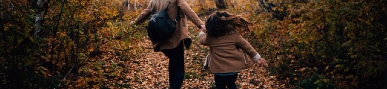 mother daughter running in fall